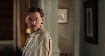 Movie still from “The Break-Up” (2006), directed by Peyton Reed – A person standing in a room; Medium shot, Over the shoulder angle