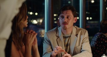 Movie still from “The Break-Up” (2006), directed by Peyton Reed – A man and a woman sitting at a dinner table; Medium shot, Over the shoulder angle