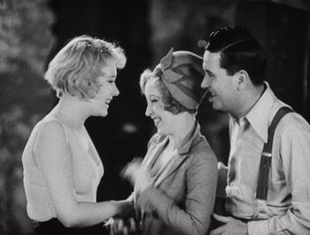 Movie still from “The Broadway Melody” (1929), directed by Harry Beaumont – A group of people that are talking to each other; Medium shot, High angle