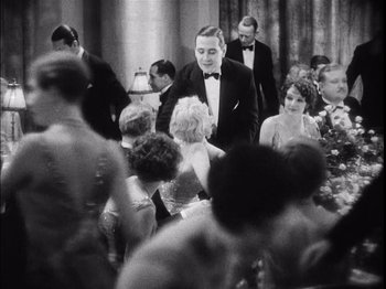 A group of people in formal wear at a party
