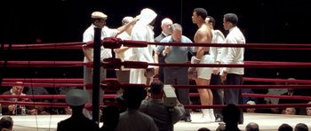 Movie still from “Ali” (2001), directed by Michael Mann – Medium shot, Low angle