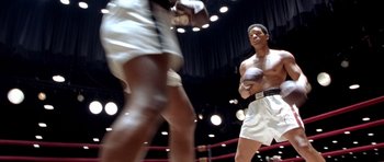 Movie still from “Ali” (2001), directed by Michael Mann – Wide shot, Low angle