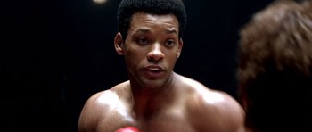 Movie still from “Ali” (2001), directed by Michael Mann – A person with a boxing glove; Close Up shot, Low angle