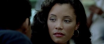 Movie still from “Ali” (2001), directed by Michael Mann – A person wearing a black jacket; Close Up shot, Over the shoulder angle