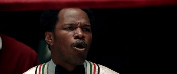 Movie still from “Ali” (2001), directed by Michael Mann – A person in a boxing ring; Close Up shot, Over the shoulder angle