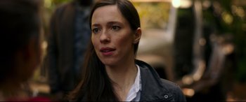 Movie still from “Godzilla vs. Kong” (2021), directed by Adam Wingard – A person with long hair; Close Up shot, Over the shoulder angle