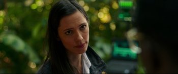 Movie still from “Godzilla vs. Kong” (2021), directed by Adam Wingard – A person with long black hair; Close Up shot, Over the shoulder angle