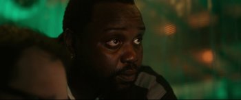 Movie still from “Godzilla vs. Kong” (2021), directed by Adam Wingard – A person looking at the camera; Close Up shot, Over the shoulder angle