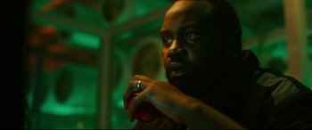 Movie still from “Godzilla vs. Kong” (2021), directed by Adam Wingard – A person with a ring on his finger; Close Up shot, Low angle