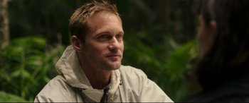 Movie still from “Godzilla vs. Kong” (2021), directed by Adam Wingard – A person wearing a jacket; Close Up shot, Over the shoulder angle