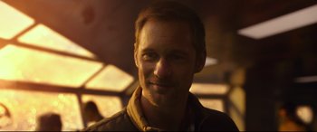 Movie still from “Godzilla vs. Kong” (2021), directed by Adam Wingard – A person smiling for the camera; Close Up shot, Over the shoulder angle