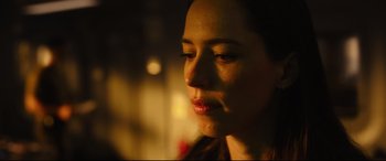 Movie still from “Godzilla vs. Kong” (2021), directed by Adam Wingard – A woman's face in the dark; Close Up shot, Low angle