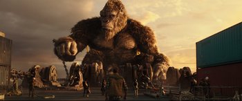 Movie still from “Godzilla vs. Kong” (2021), directed by Adam Wingard – An image of a giant gorilla in the middle of a group of people; Extreme Wide shot, Low angle