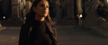 Movie still from “Godzilla vs. Kong” (2021), directed by Adam Wingard – A beautiful young lady wearing a black shirt; Close Up shot, Low angle