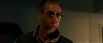 Movie still from “Godzilla vs. Kong” (2021), directed by Adam Wingard – A person wearing sunglasses; Close Up shot, Low angle