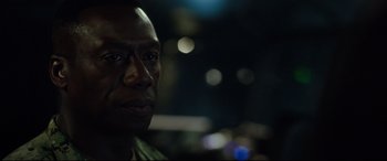 Movie still from “Godzilla vs. Kong” (2021), directed by Adam Wingard – A man's face at night; Close Up shot, Over the shoulder angle