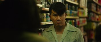 Movie still from “Godzilla vs. Kong” (2021), directed by Adam Wingard – A man in a white shirt is looking at the camera; Close Up shot, Over the shoulder angle