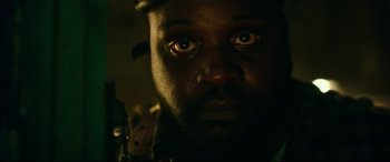 Movie still from “Godzilla vs. Kong” (2021), directed by Adam Wingard – A person's face in a dark room; Close Up shot, Low angle