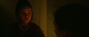 Movie still from “Godzilla vs. Kong” (2021), directed by Adam Wingard – A young girl looking into a mirror in the dark; Close Up shot, Over the shoulder angle