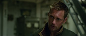 Movie still from “Godzilla vs. Kong” (2021), directed by Adam Wingard – A person wearing a jacket; Close Up shot, Over the shoulder angle