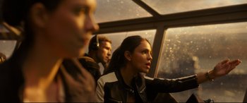 Movie still from “Godzilla vs. Kong” (2021), directed by Adam Wingard – Three people are sitting in a bus looking out the window; Close Up shot, Over the shoulder angle