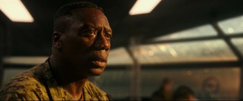 Movie still from “Godzilla vs. Kong” (2021), directed by Adam Wingard – A person looking up at the sky; Close Up shot, Low angle