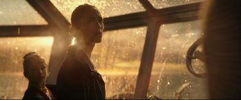 Movie still from “Godzilla vs. Kong” (2021), directed by Adam Wingard – A man standing in front of a large window; Close Up shot, Low angle