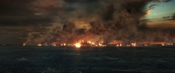 Movie still from “Godzilla vs. Kong” (2021), directed by Adam Wingard – An ocean filled with lots of fire and smoke; Extreme Wide shot, High angle
