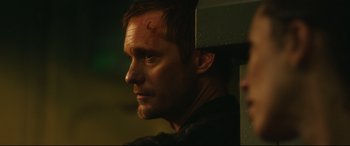 Movie still from “Godzilla vs. Kong” (2021), directed by Adam Wingard – A person wearing a black shirt; Close Up shot, Over the shoulder angle