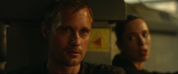 Movie still from “Godzilla vs. Kong” (2021), directed by Adam Wingard – A person wearing a black shirt; Close Up shot, Over the shoulder angle