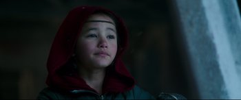 Movie still from “Godzilla vs. Kong” (2021), directed by Adam Wingard – A young girl wearing a red hooded jacket; Close Up shot, Low angle