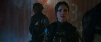 Movie still from “Godzilla vs. Kong” (2021), directed by Adam Wingard – A woman standing next to a man in a room; Close Up shot, Over the shoulder angle