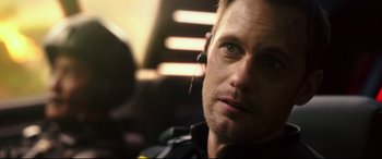 Movie still from “Godzilla vs. Kong” (2021), directed by Adam Wingard – A person wearing headphones; Close Up shot, Over the shoulder angle