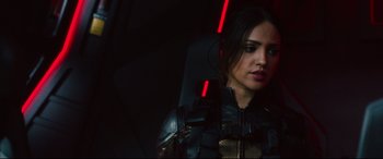 Movie still from “Godzilla vs. Kong” (2021), directed by Adam Wingard – A woman in a leather jacket is in the dark; Close Up shot, Over the shoulder angle