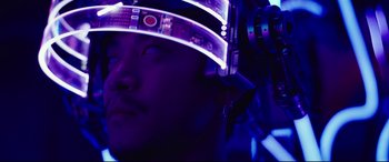 Movie still from “Godzilla vs. Kong” (2021), directed by Adam Wingard – A man wearing a helmet and headphones in a dark room; Close Up shot, Low angle