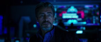 Movie still from “Godzilla vs. Kong” (2021), directed by Adam Wingard – A person wearing a suit and tie; Close Up shot, Over the shoulder angle