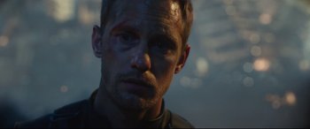 Movie still from “Godzilla vs. Kong” (2021), directed by Adam Wingard – A person with a bruise on his face; Close Up shot, Over the shoulder angle