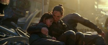 Movie still from “Godzilla vs. Kong” (2021), directed by Adam Wingard – A woman and a child are sitting together; Close Up shot, Over the shoulder angle