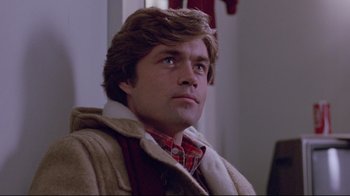 Movie still from “The Brood” (1979), directed by David Cronenberg – A person wearing a jacket; Close Up shot, Low angle