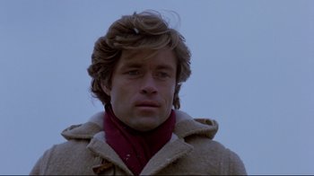 Movie still from “The Brood” (1979), directed by David Cronenberg – A person wearing a jacket; Close Up shot, Low angle