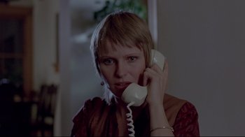 Movie still from “The Brood” (1979), directed by David Cronenberg – A woman holding a phone to her ear; Close Up shot, Low angle