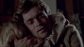 Movie still from “The Brood” (1979), directed by David Cronenberg – A person sleeping on a couch; Close Up shot, High angle