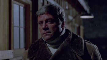 Movie still from “The Brood” (1979), directed by David Cronenberg – A person wearing a sweater; Close Up shot, Low angle