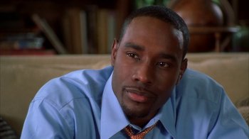 Movie still from “The Brothers” (2001), directed by Gary Hardwick – A person wearing a shirt and tie; Close Up shot, High angle