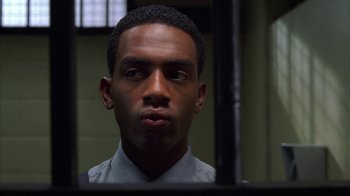 Movie still from “The Brothers” (2001), directed by Gary Hardwick – A person in a jail cell; Close Up shot, Low angle