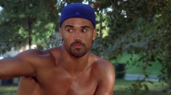 Movie still from “The Brothers” (2001), directed by Gary Hardwick – A person with a hat on; Close Up shot, High angle