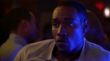 Movie still from “The Brothers” (2001), directed by Gary Hardwick – A person wearing a white shirt; Close Up shot, Over the shoulder angle