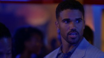 Movie still from “The Brothers” (2001), directed by Gary Hardwick – A person wearing a suit and tie; Close Up shot, Over the shoulder angle