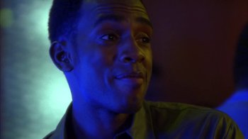 Movie still from “The Brothers” (2001), directed by Gary Hardwick – A person wearing a green shirt; Close Up shot, Over the shoulder angle