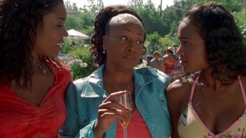 Movie still from “The Brothers” (2001), directed by Gary Hardwick – A group of women standing next to each other holding wine glasses; Close Up shot, Over the shoulder angle